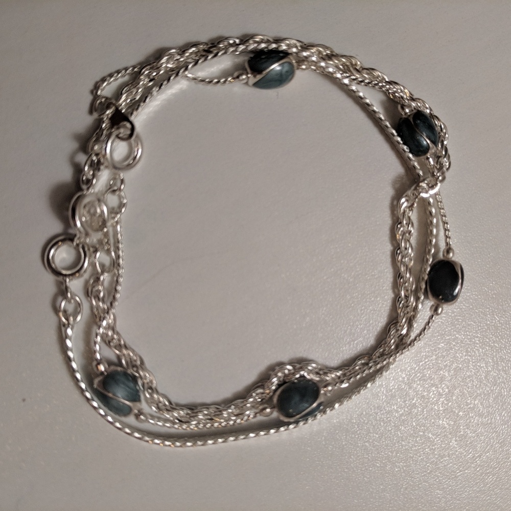 NWOT 3 layered bracelet silver colored
